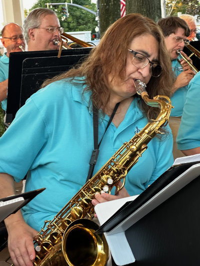 saxophone musician playing with band