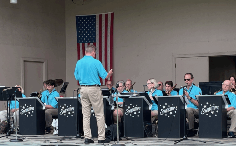 swingtime band performing on stage with ed conducting