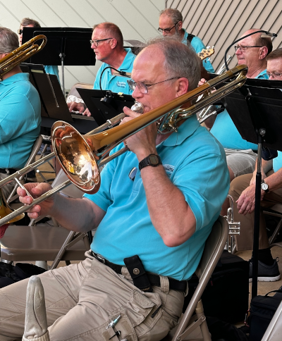 trombone musician playing a tune with band